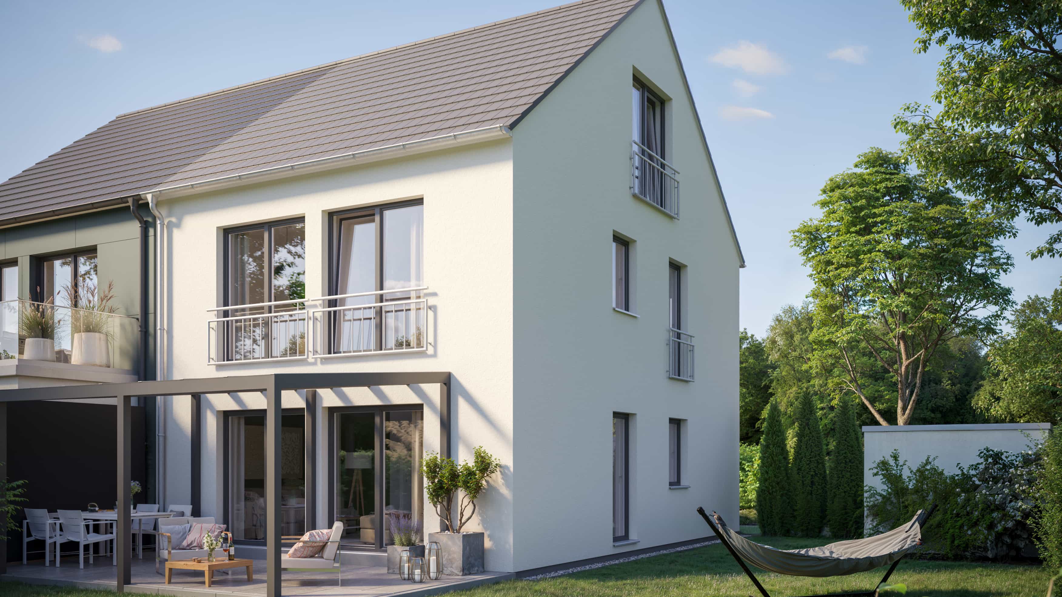 Visualisierung der Giebelseite des Haas Doppelhauses D 112 mit Balkon und Hängematte im Garten